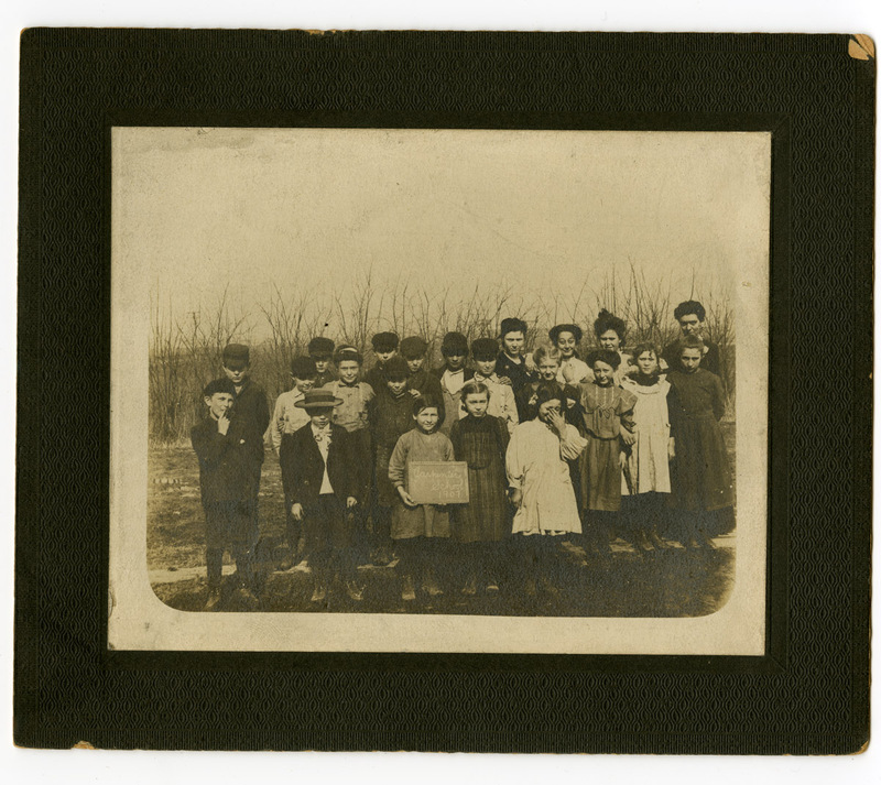 1907 Photograph of Children Holding a Chalkboard with "Carpenter School" On It