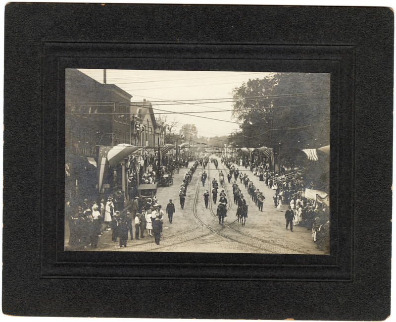 Photograph of Marching Band Led by Men on Horses