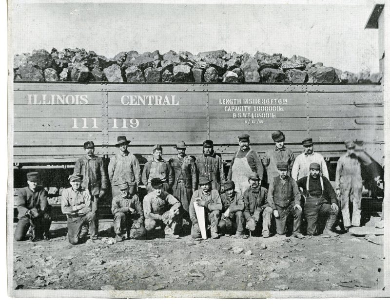 Coal Miners in front of railroad car filled with coal
