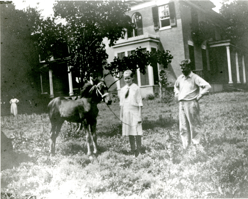 Girl with a horse in front ofthe Mudge home (Oakdale) on the Mudge farm in Grantfork