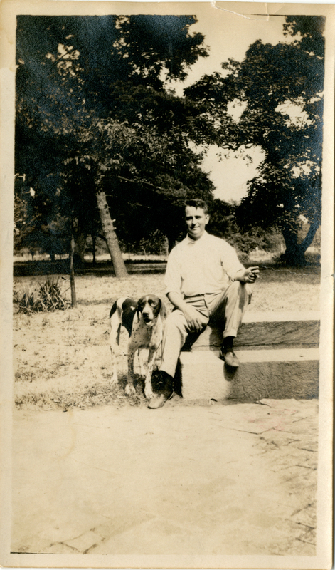 Photograph of a man and dog on Mudge farm in Grantfork.