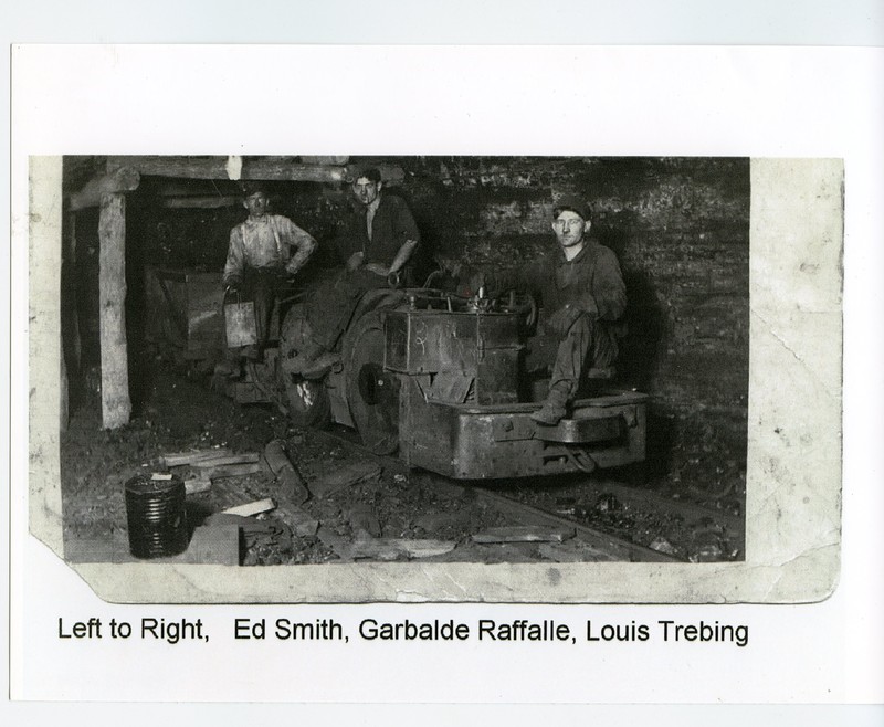 3 men inside coal mine #2 sitting on coal carts