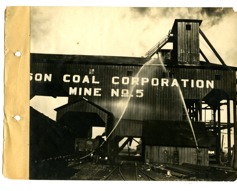 Men hosing down the outside of Madison Coal Corporation Mine No. 5