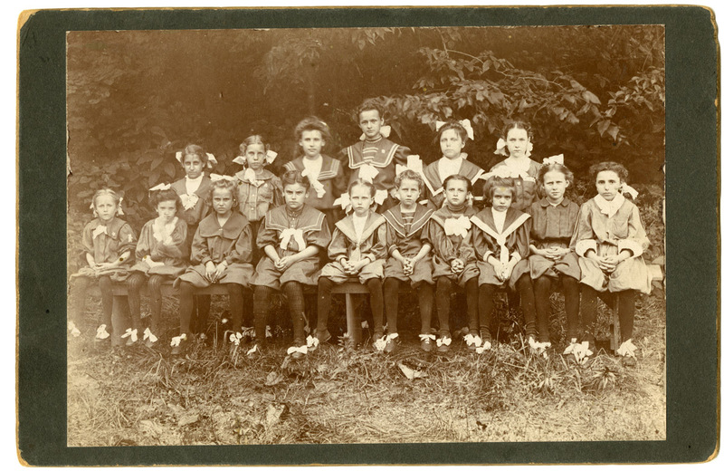 Photograph of Sixteen Girls in Sailor-Style Dresses