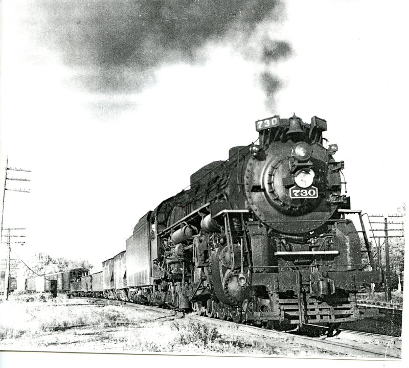 Steam Engine No. 730 Pulling Various Train Cars 