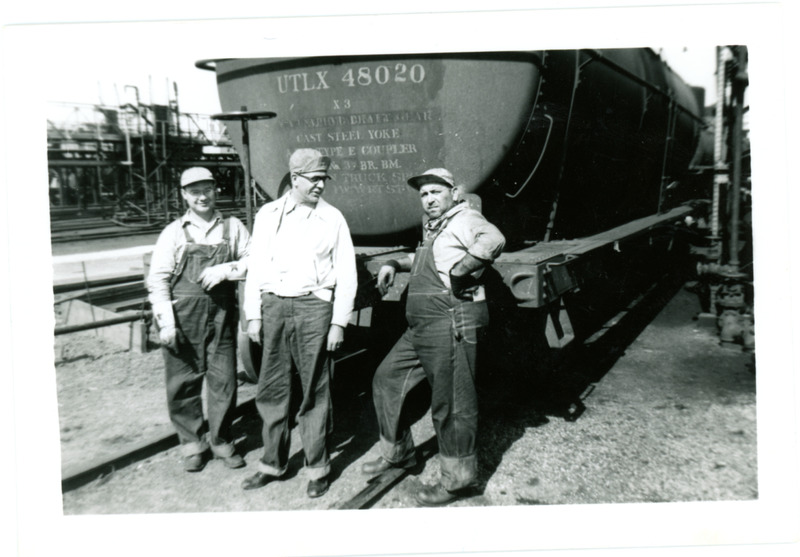 1952 Three Men Chatting Behind Oil Rail Car on Tracks