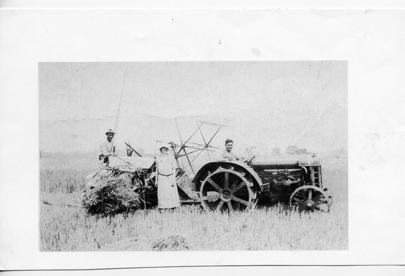 Side View of Anna and Emil Brockmeir with Herb Maack on tractor. 