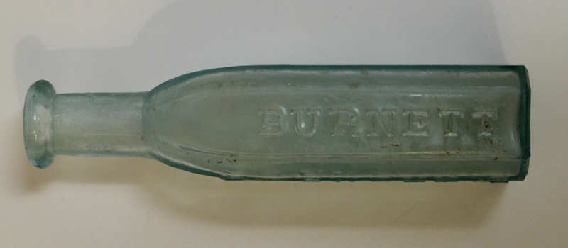 Burnett Company Glass Medicine Bottle