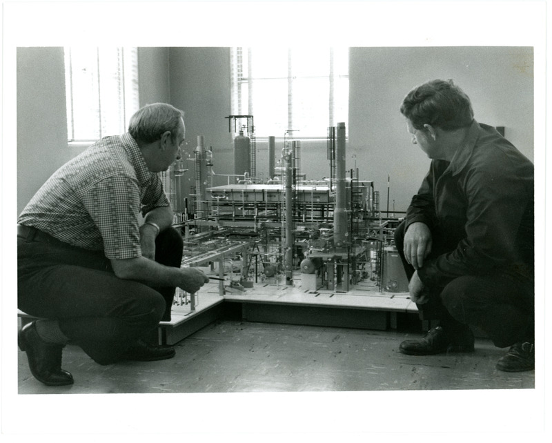 1974 Employees Around Scale Model of Refinery