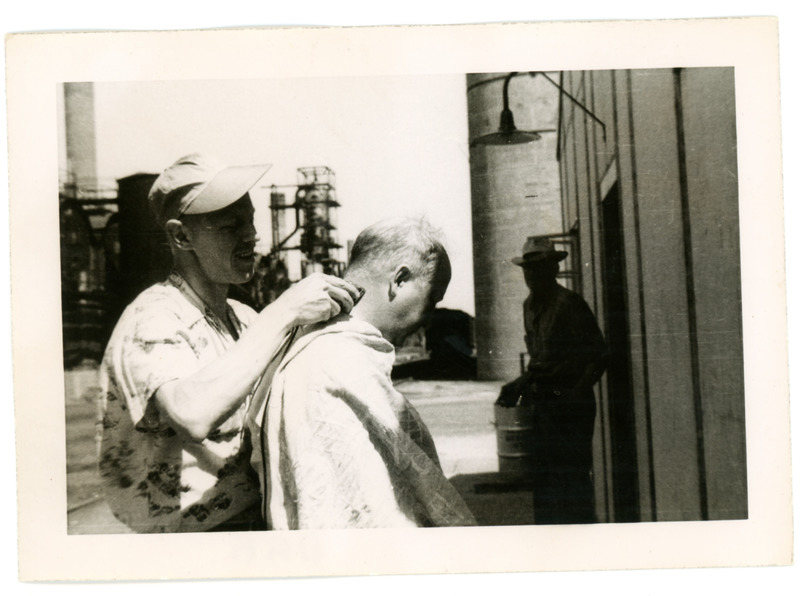 1952 Portrait of Man Getting Haircut in Refinery Yard During Standard Oil Strike