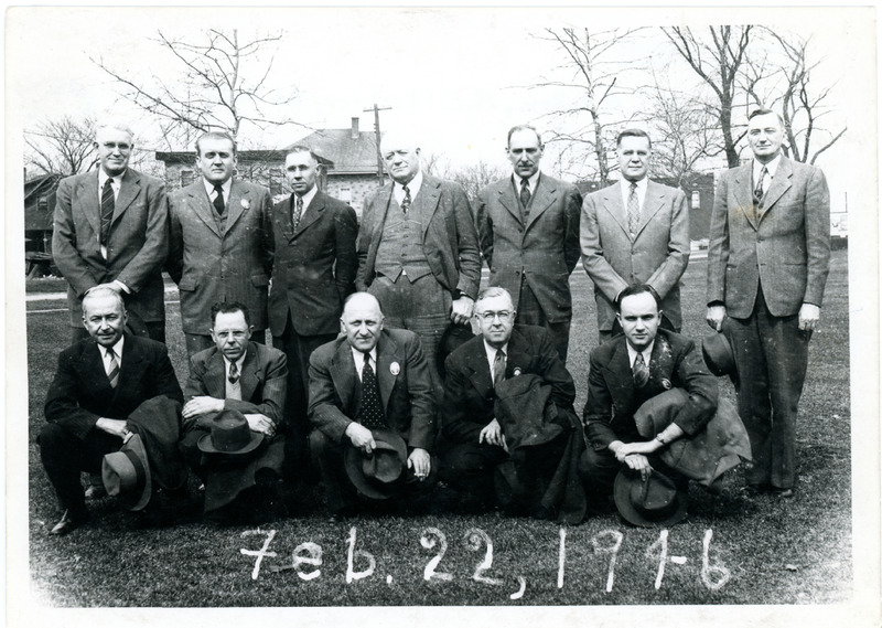1946 Twelve Men Posing for Group Photograph in Suits