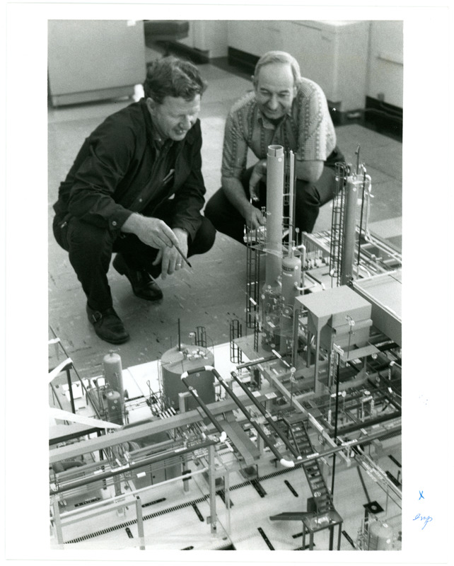 1974 Photo of Employees Around a Scale Model of the Standard Oil Refinery
