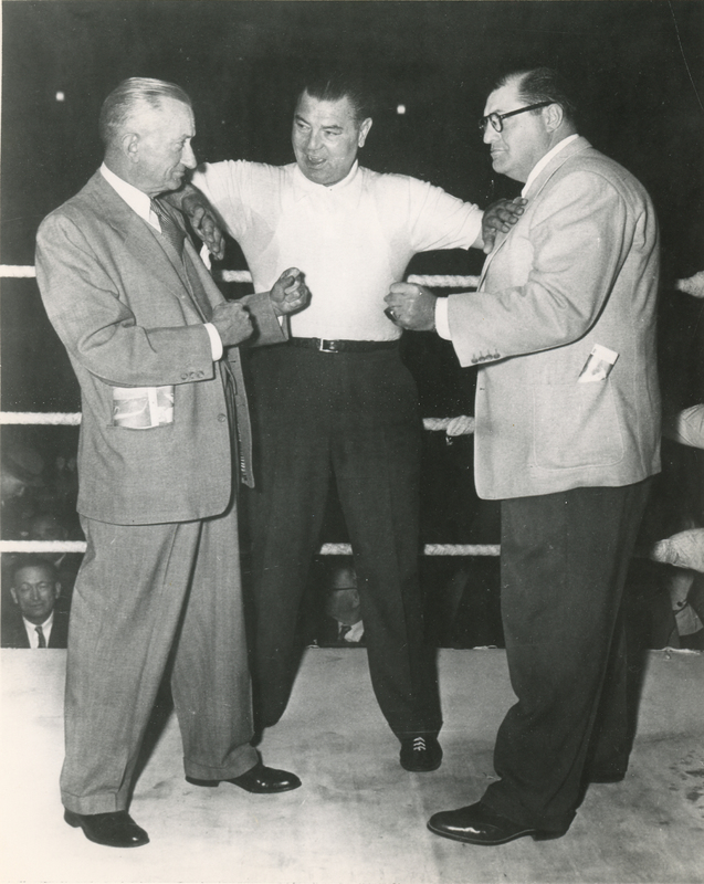 Jimmy Callahan, Jack (unknown) and George Musso in a boxing ring