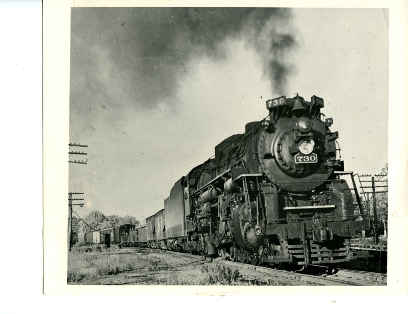 Steam Engine No. 730 Pulling Various Train Cars 