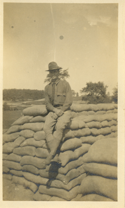 Alfred sitting alone in a WWI Uniform