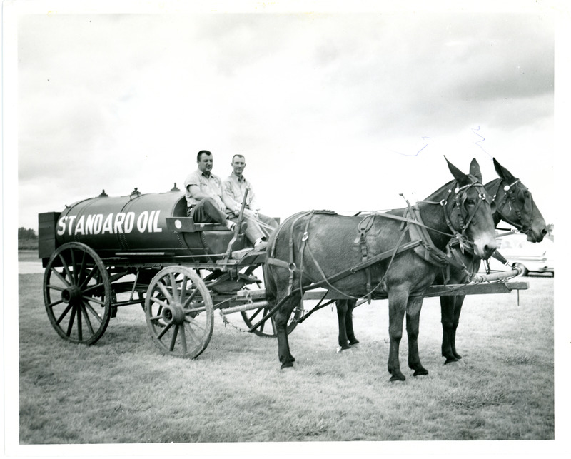 Mules Pulling Standard Oil Tank with Two Men on Wagon