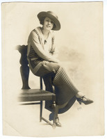 Photograph of &quot;Fern,&quot; a Woman Leaning on a Chair Wearing a Hat