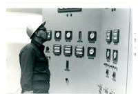 1967 Man Examining Instrument Paneling 