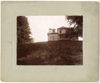 Photograph of a House with a Western Military Academy Building in the Background