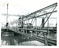 1957 Photgraph People walking to Barge across bridge for Open House Refinery Tour