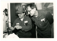 Two men Calibrating Instruments 