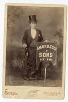 Photograph of Woman  Holding &quot;Ambrosius &amp; Sons&quot; Sign