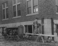 1926 Man Utilizing a Drill and Compressor to Repair the Madison County Tuberculosis Sanitarium in Edwardsville after Mine Subsidence